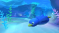 A penguin swimming in the underwater section